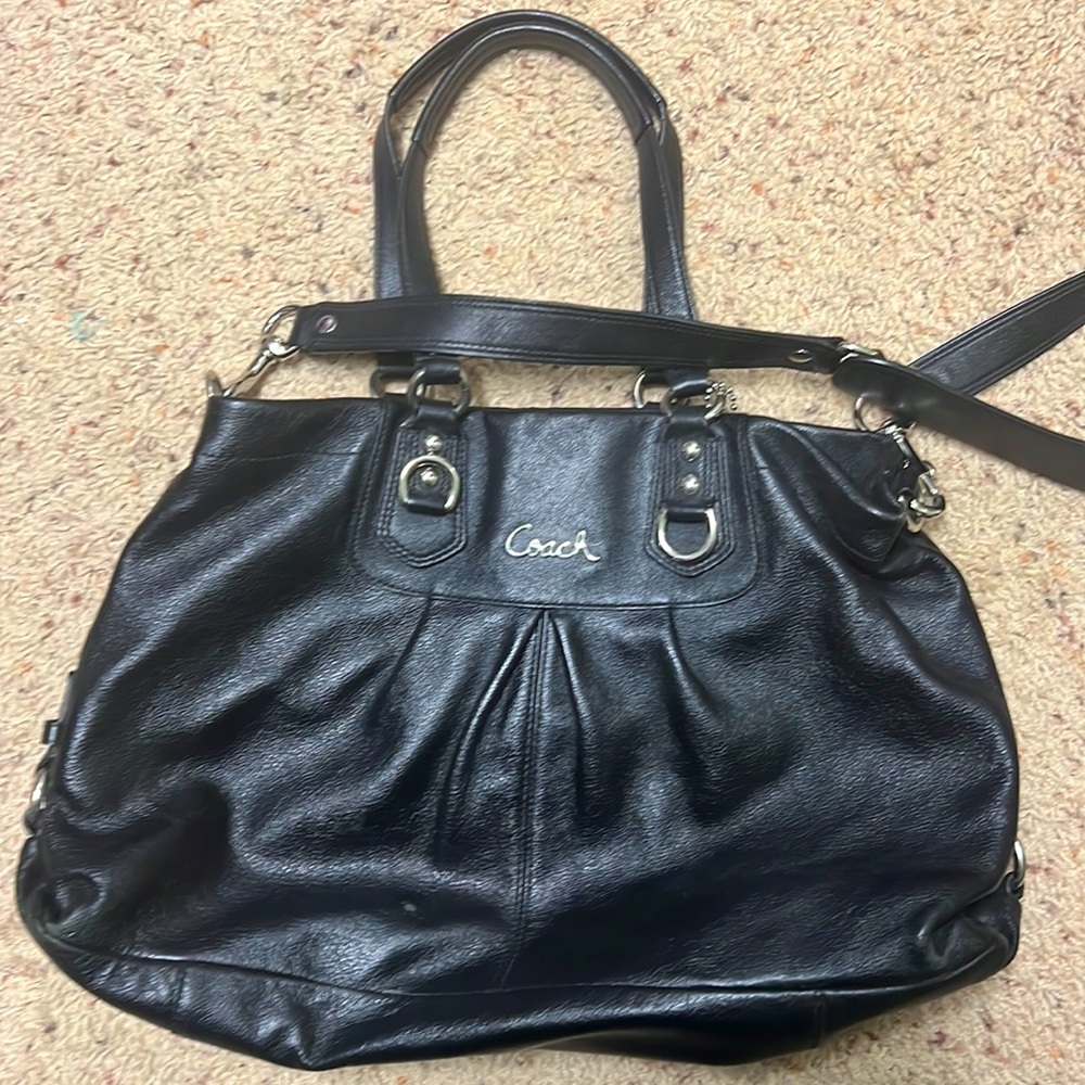 Black Coach purple lining.